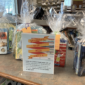 Photo of the Children's Book Week sign and four packaged book sets for age groups.